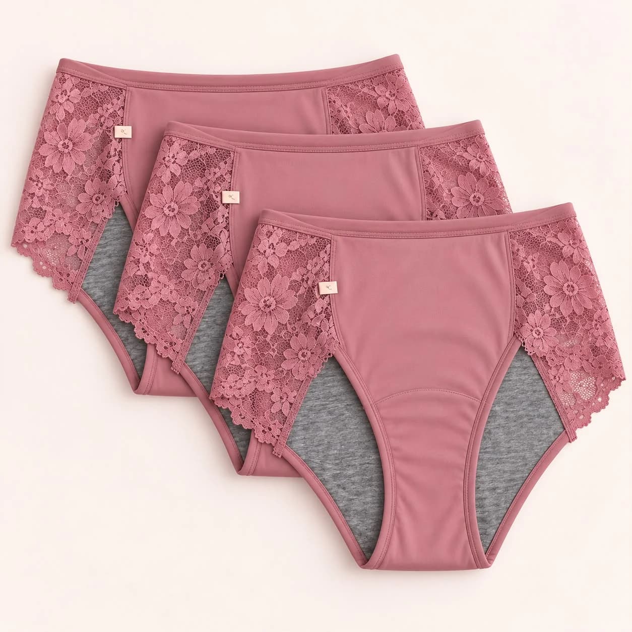 Three pairs of Pam Velour Silky period underwear with floral lace side panels